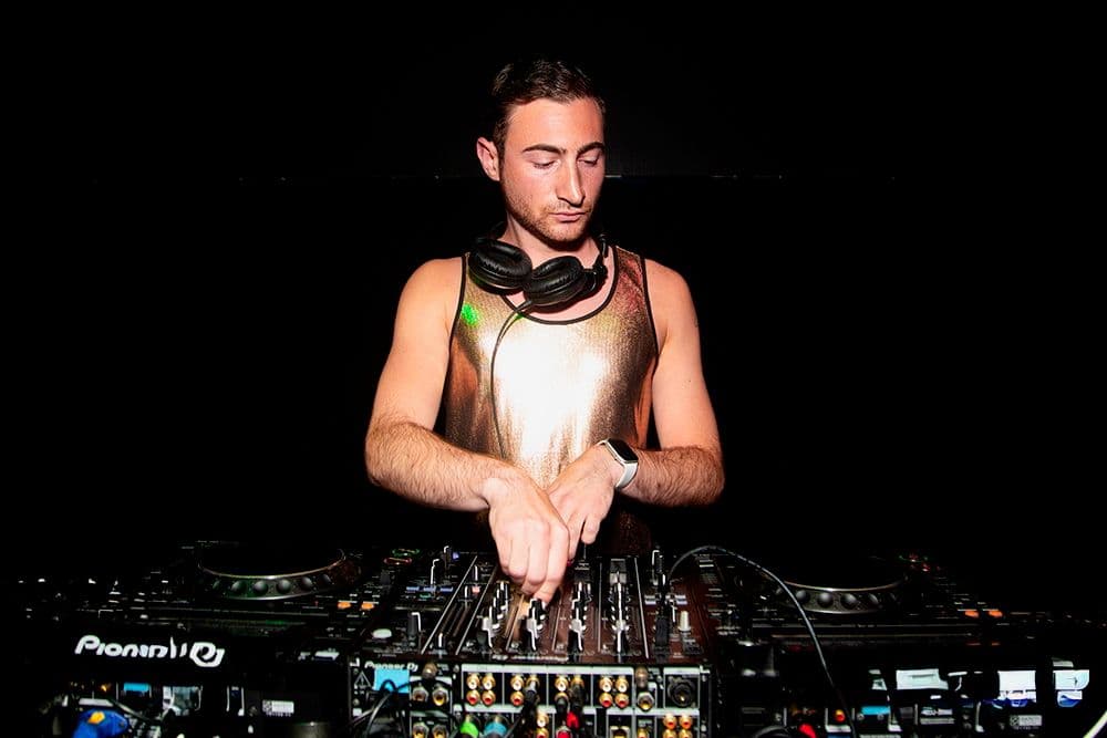 DJ Alex Cohen behind the decks at HK Hall, 2024