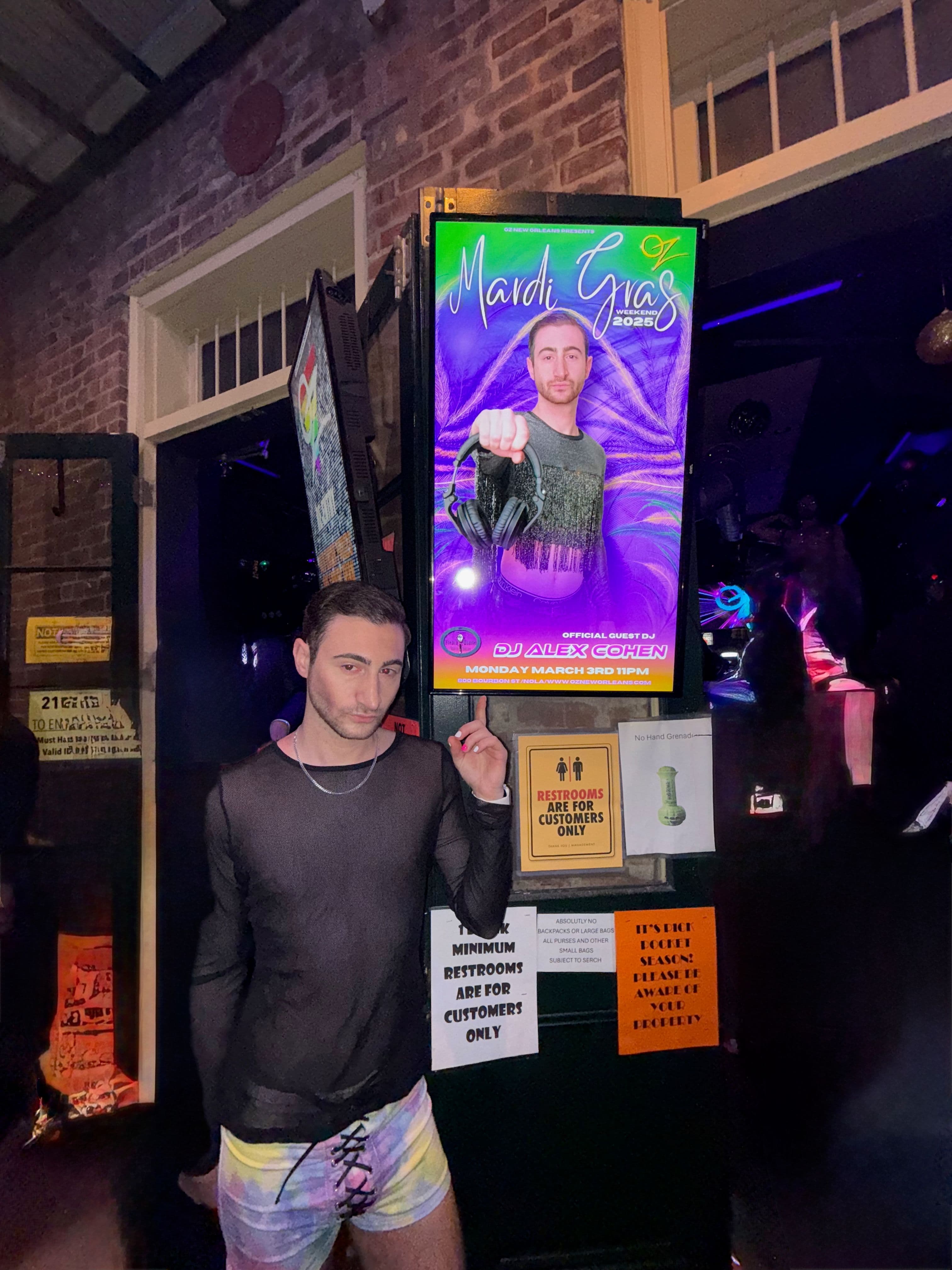 DJ Alex Cohen poses outside OZ Nightclub on Bourbon Street just before his Mardi Gras Set, 2025